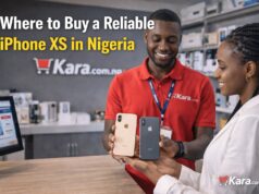 Where to Buy a Reliable iPhone XS in Nigeria? Kara.com.ng store staff showing iPhone XS phones to a customer inside a smartphone retail shop in Nigeria.