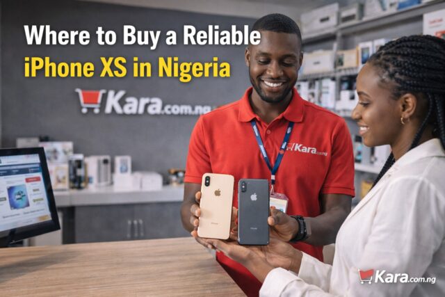 Kara.com.ng store staff showing iPhone XS phones to a customer inside a smartphone retail shop in Nigeria.
