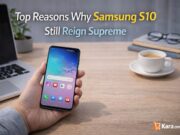 Top reasons why Samsung S10 still reign Supreme Person holding a Samsung Galaxy S10 smartphone on a modern desk workspace with laptop and coffee cup while highlighting why the phone remains popular.